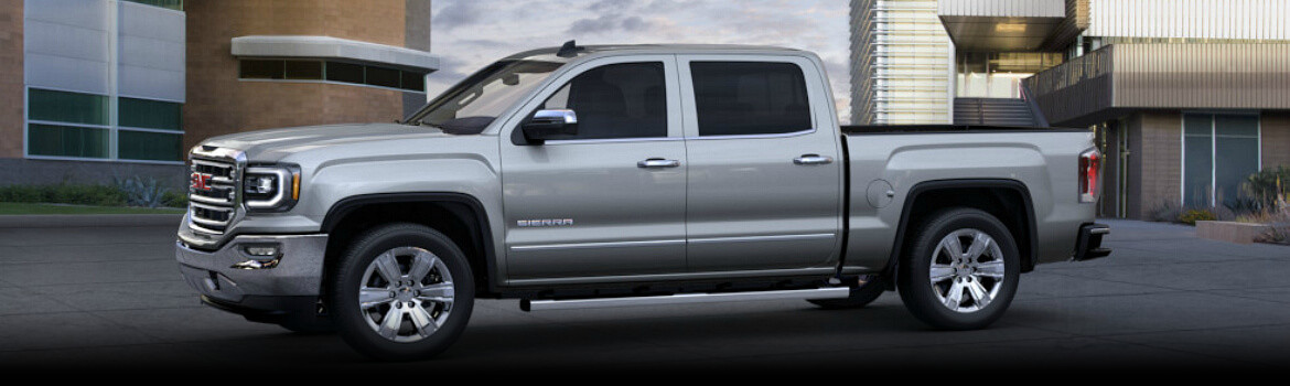 2017 Sierra GMC parked outside of a building